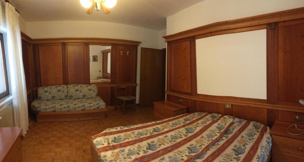 Postel nebo postele na pokoji v ubytování Appartamento Cogolo con terrazza 7 posti