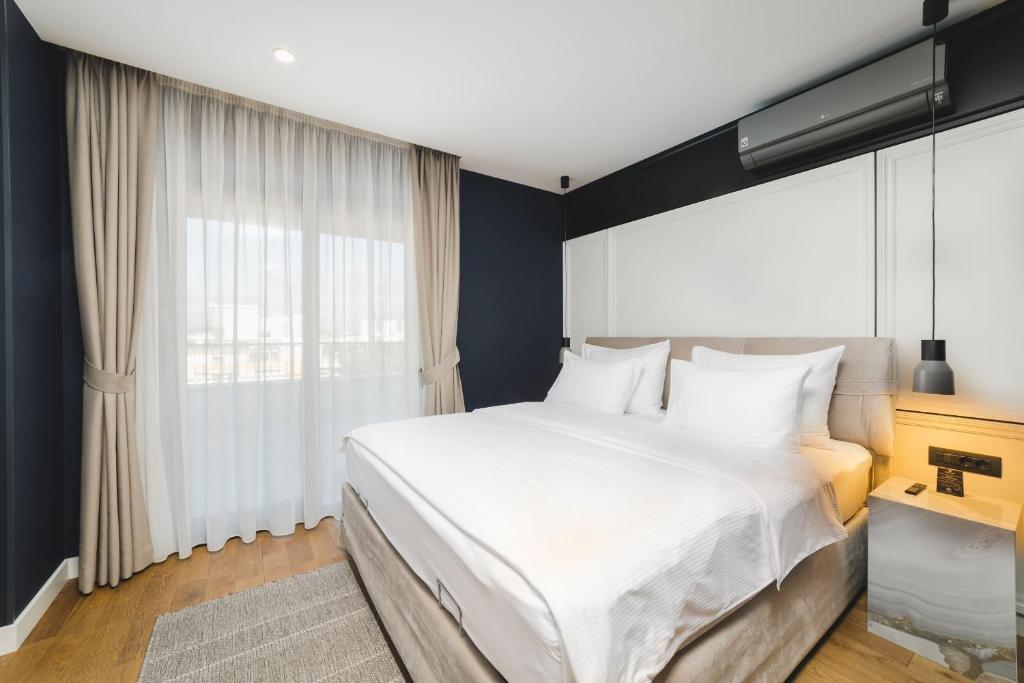 Postel nebo postele na pokoji v ubytování SIGNUM Hotel