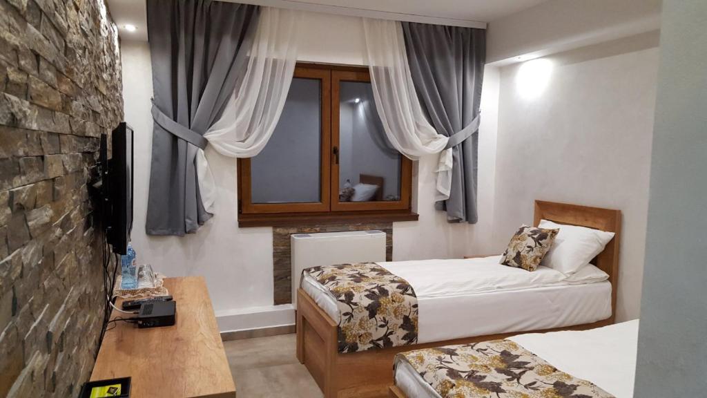 Postel nebo postele na pokoji v ubytování Bački dvor
