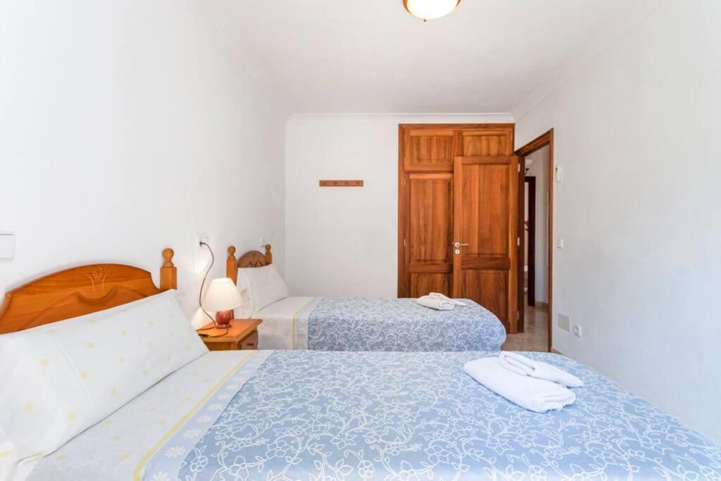 A bed or beds in a room at M0 Práctico y Sencillo Apartamento a 100 m de las mejores playas de Mallorca