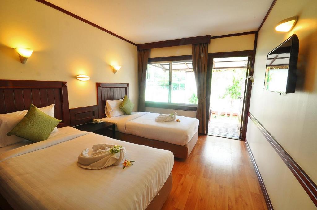 Postel nebo postele na pokoji v ubytování Isle Beach Resort Krabi-SHA