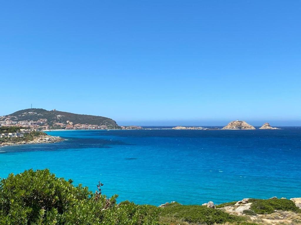 a view of the ocean with islands in the distance at Mobilhomme LECCI 3 CHAMBRES AVEC VUE MER EXCEPTIONNELLE in Lumio