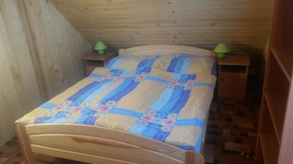 Posteľ alebo postele v izbe v ubytovaní Chalupa Tália