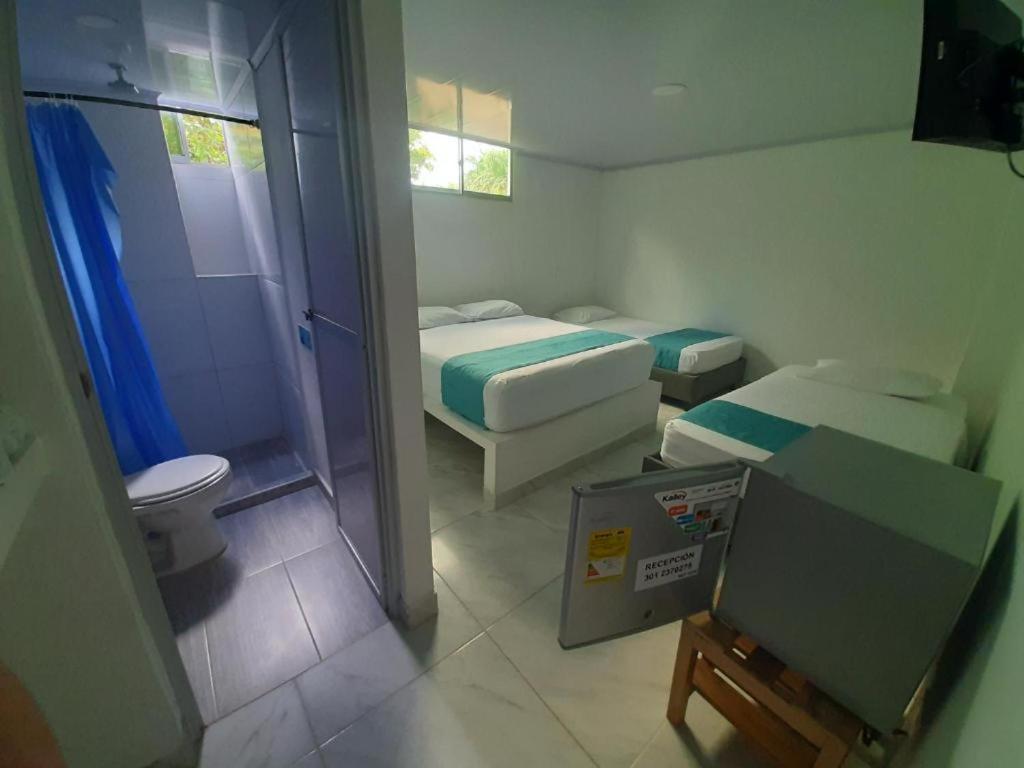 Postel nebo postele na pokoji v ubytování Sky view hotel tolu