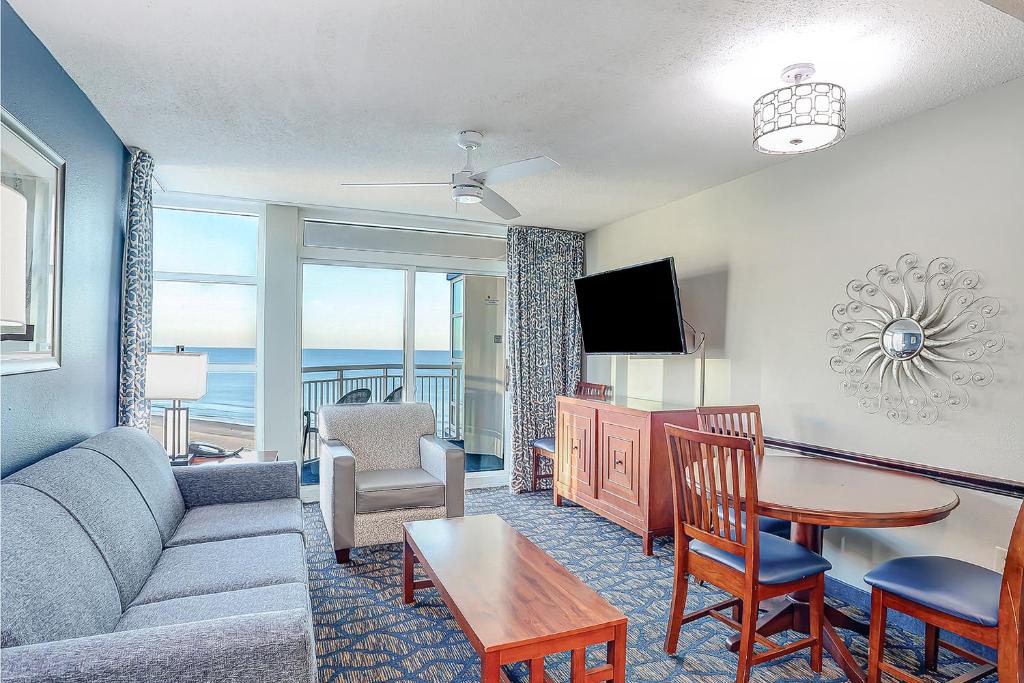 a living room with a couch and a table at Ocean Blvd Resort, Unit #1234 in Myrtle Beach
