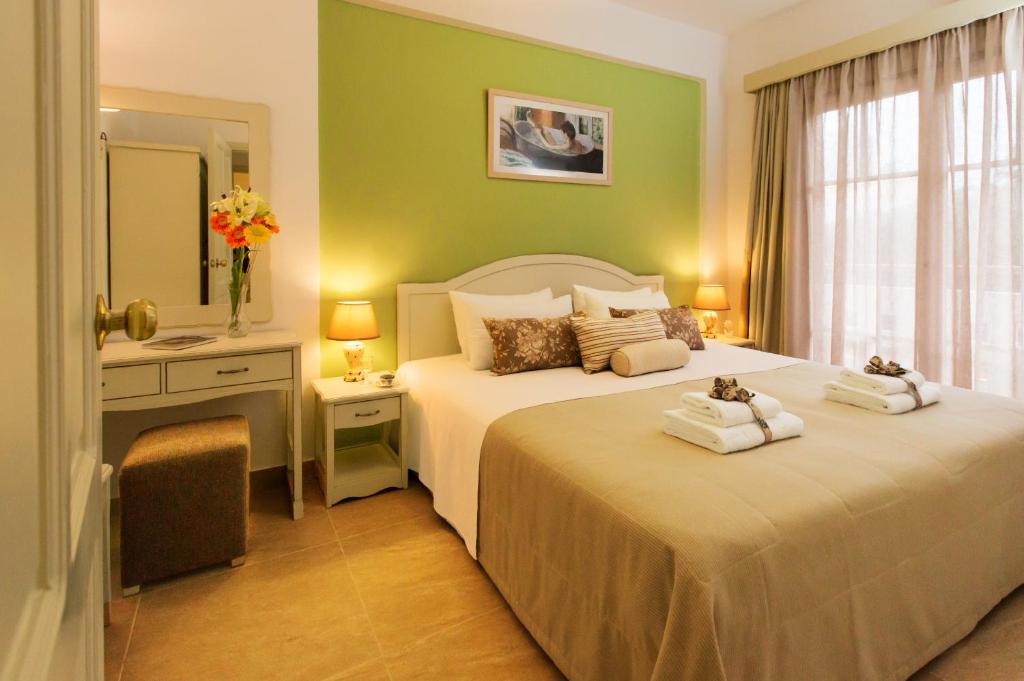 Postel nebo postele na pokoji v ubytování Agrimia Holiday Apartments