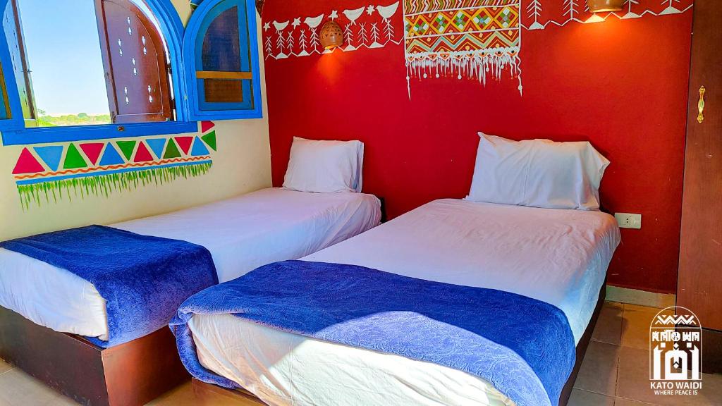 Postel nebo postele na pokoji v ubytování Kato Waidi Nubian Resort