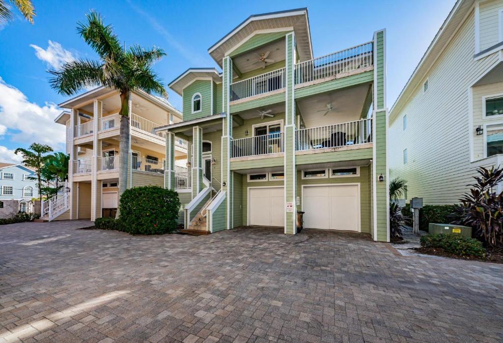 a large apartment building with a parking lot at Exclusive Isla Bonita in Clearwater Beach
