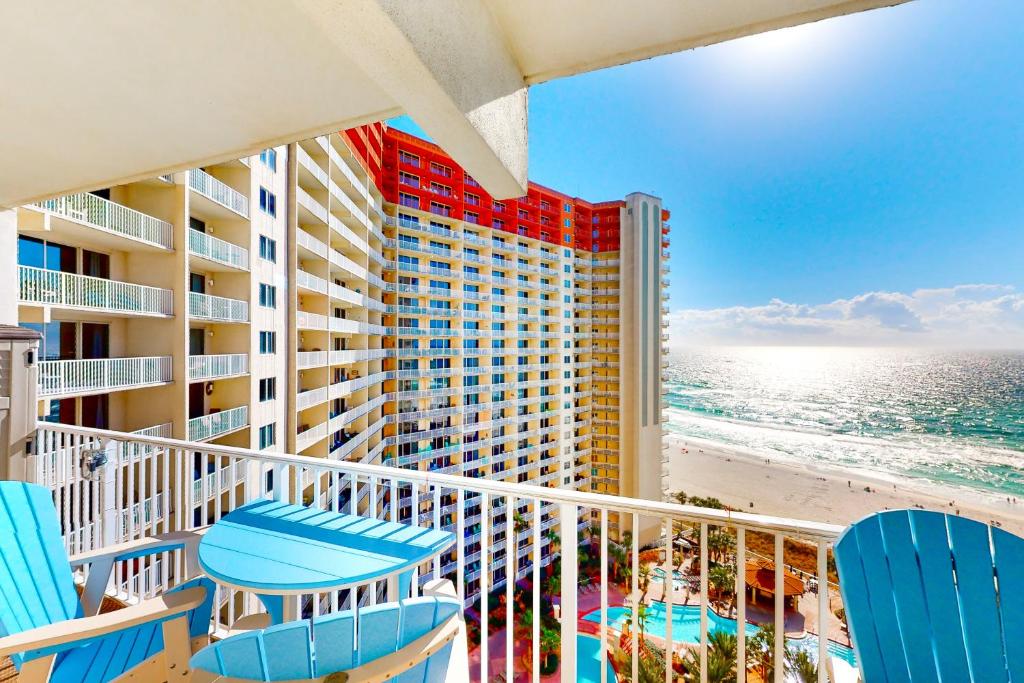 a balcony of a hotel with chairs and the beach at Shores of Panama, Unit #1415 in Panama City Beach