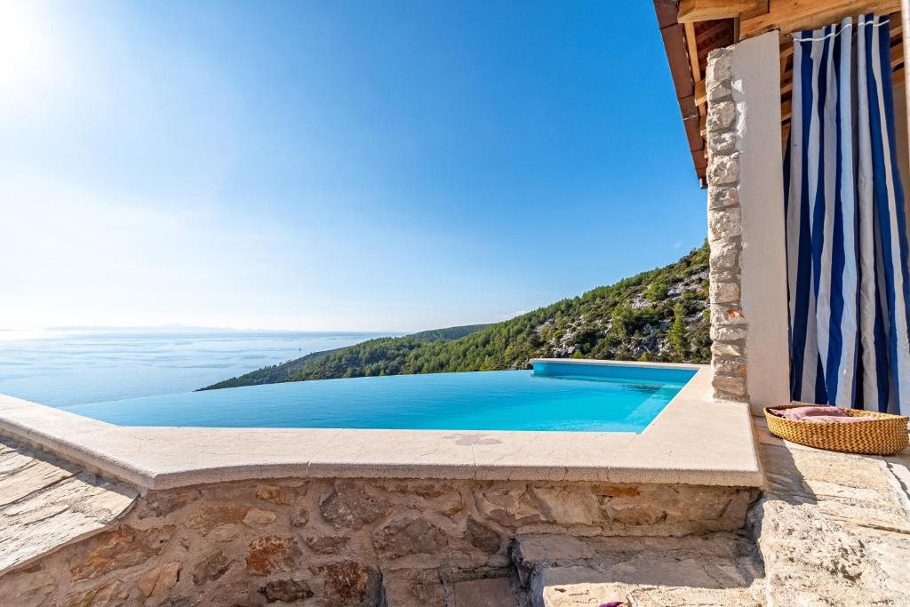 a swimming pool in a villa with a view at Villa Defora in Korčula