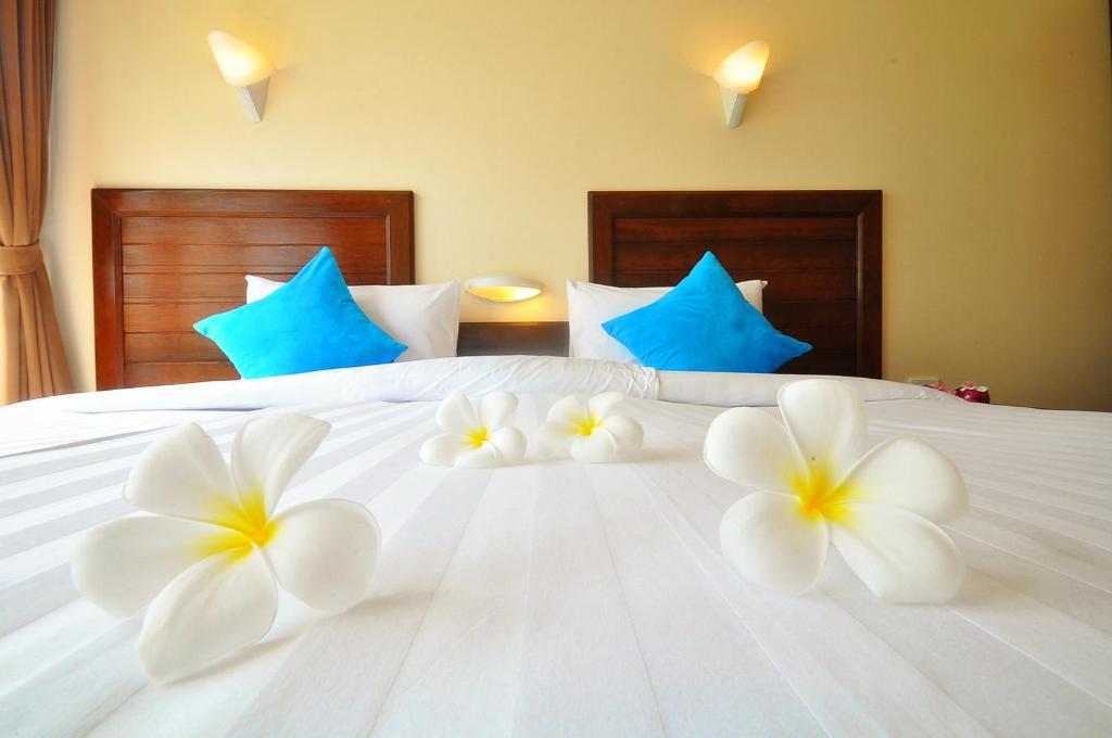 Postel nebo postele na pokoji v ubytování Isle Beach Resort Krabi-SHA