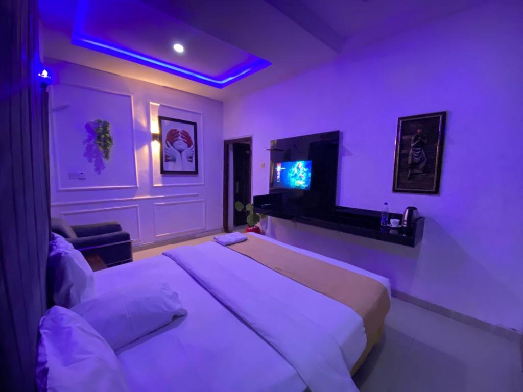 Postel nebo postele na pokoji v ubytování Palazzo Apartments