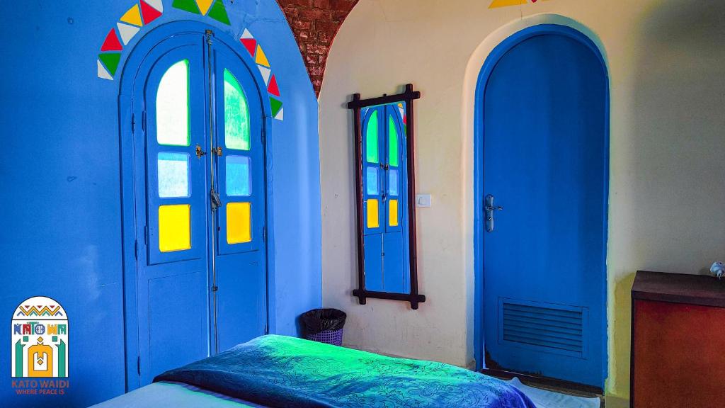 Postel nebo postele na pokoji v ubytování Kato Waidi Nubian Resort