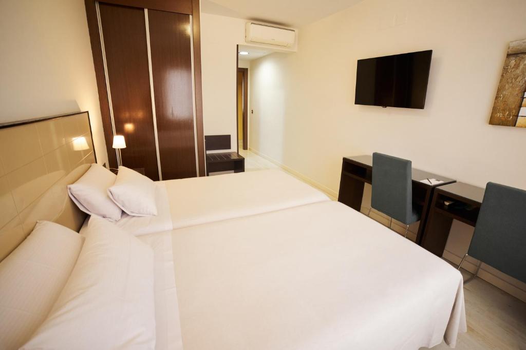 Postel nebo postele na pokoji v ubytování El Hostal de Violeta