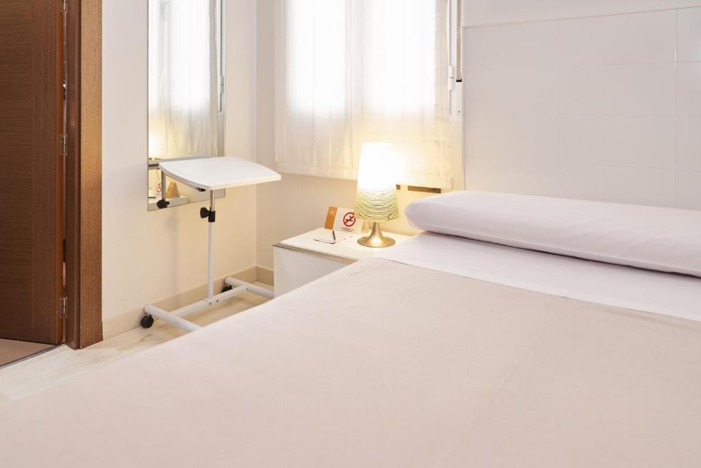 Postel nebo postele na pokoji v ubytování El Hostal de Violeta