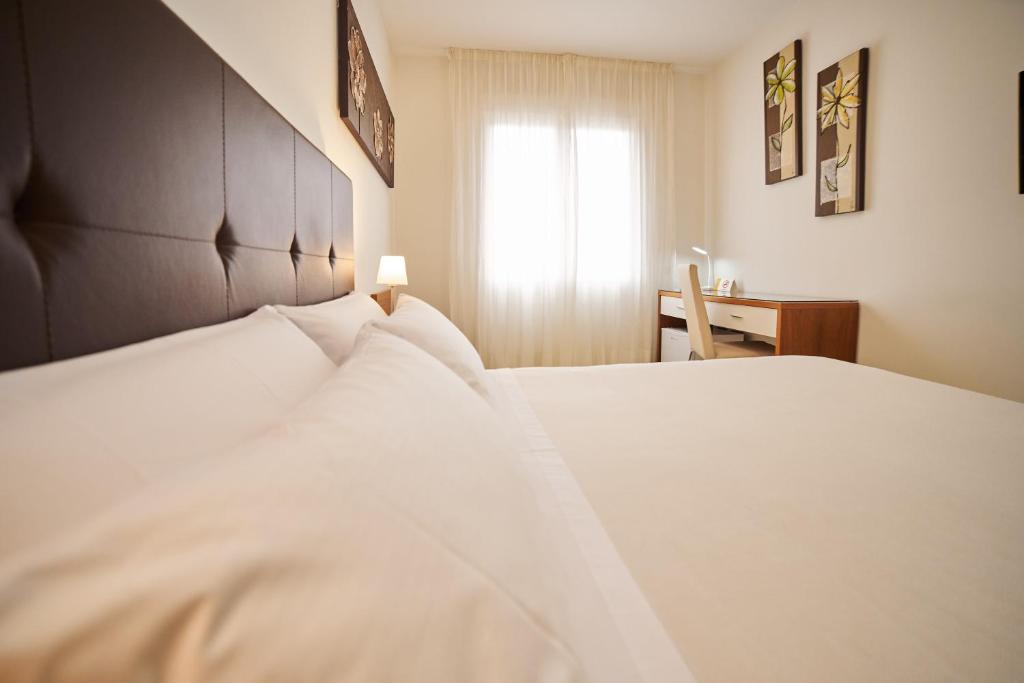 Postel nebo postele na pokoji v ubytování El Hostal de Violeta