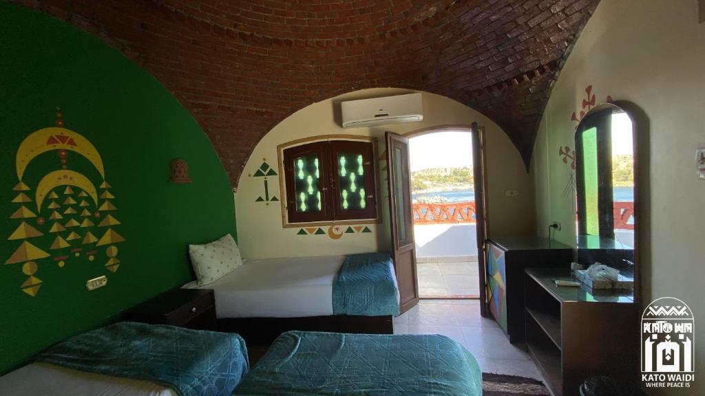 Postel nebo postele na pokoji v ubytování Kato Waidi Nubian Resort