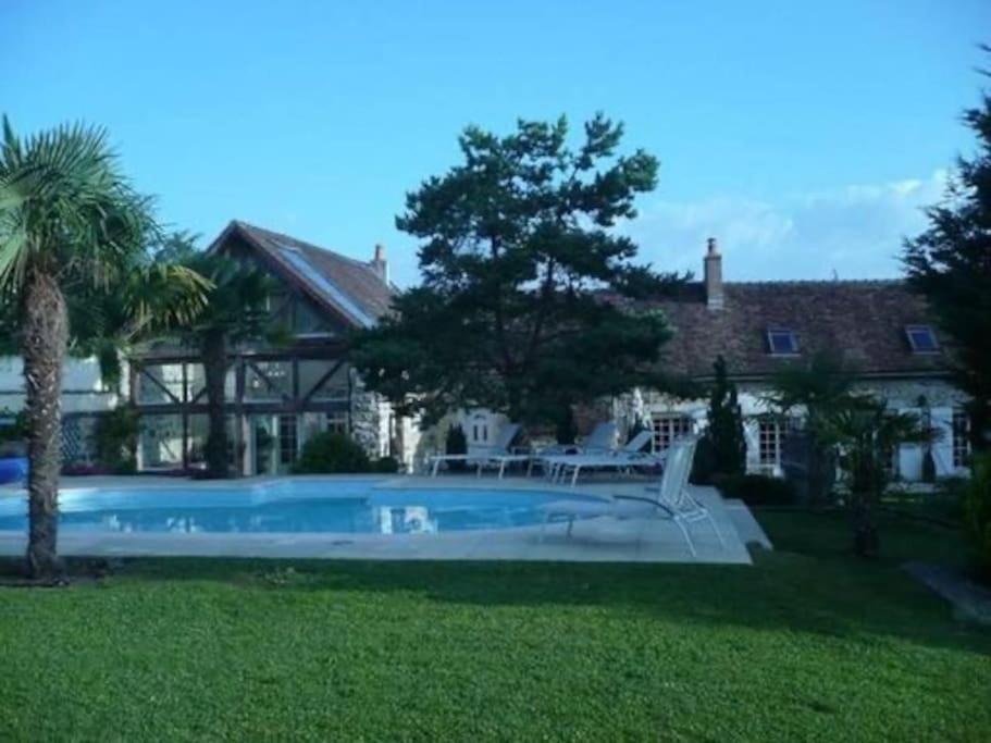 Kolam renang di atau dekat dengan Belle demeure à 1h20 de Paris avec piscine chauffée, 19 pers