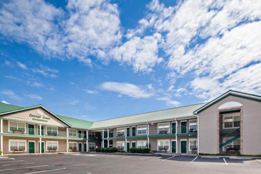 an empty parking lot in front of a hotel at Colonial Crest 107 - Great location! - You can walk to town! condo in Pigeon Forge