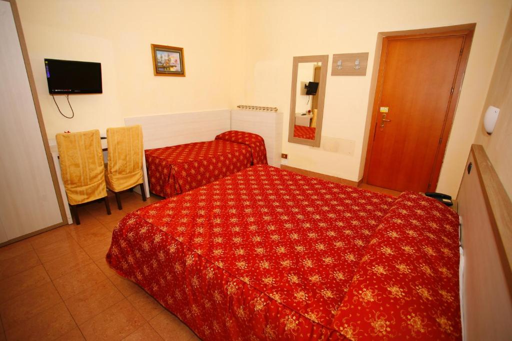 Postel nebo postele na pokoji v ubytování Hotel Adler