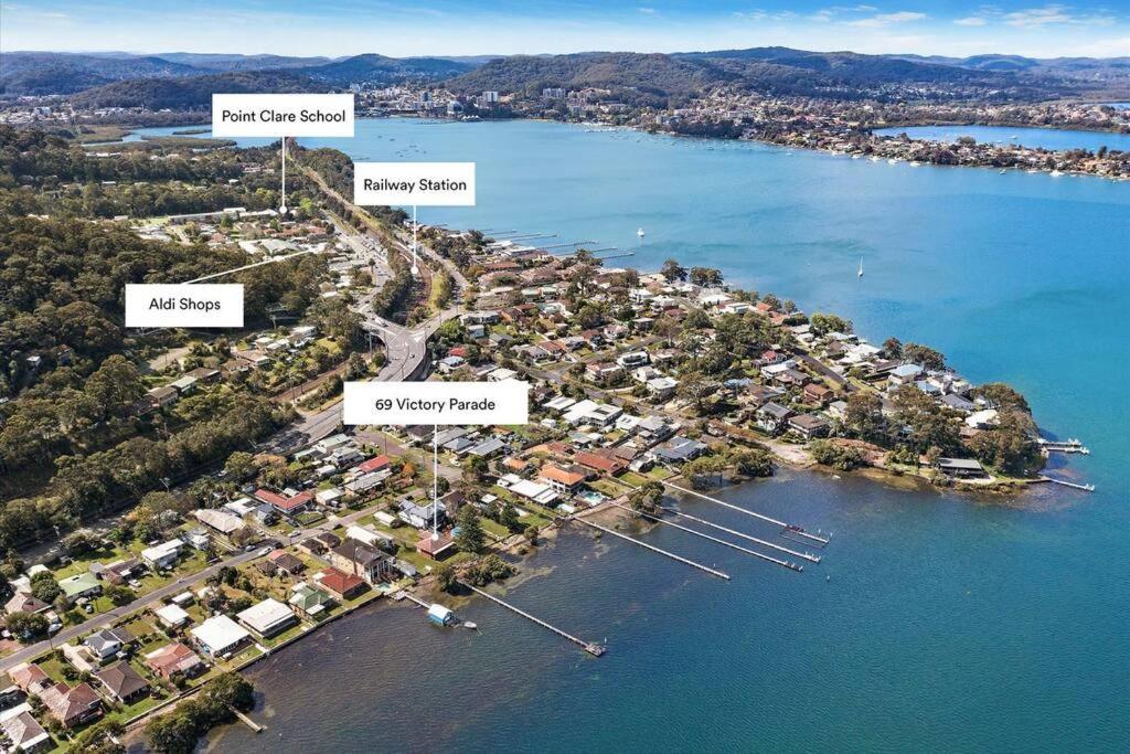 an aerial view of an island in a body of water at Seaside Cottage with Jetty in Point Clare