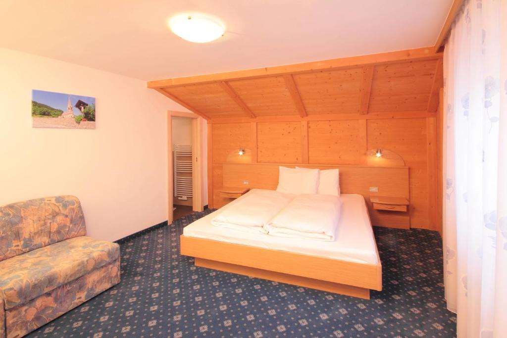 Postel nebo postele na pokoji v ubytování Pension & Residence Astoria
