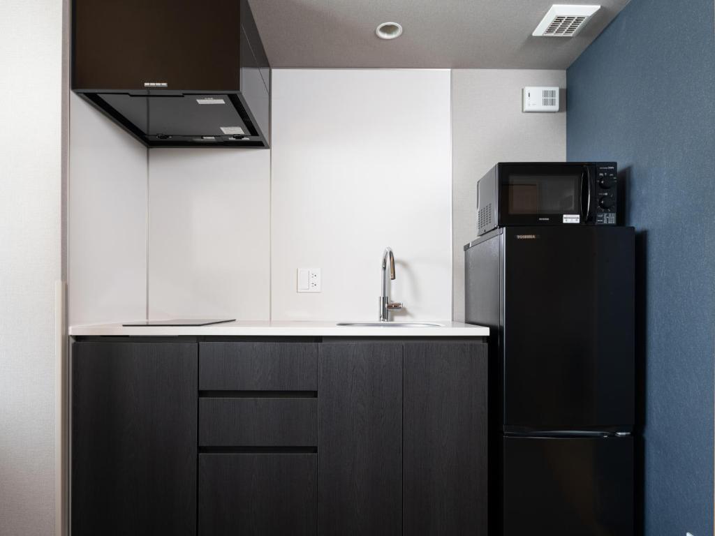 Kuchyň nebo kuchyňský kout v ubytování MIMARU SUITES Tokyo Asakusa