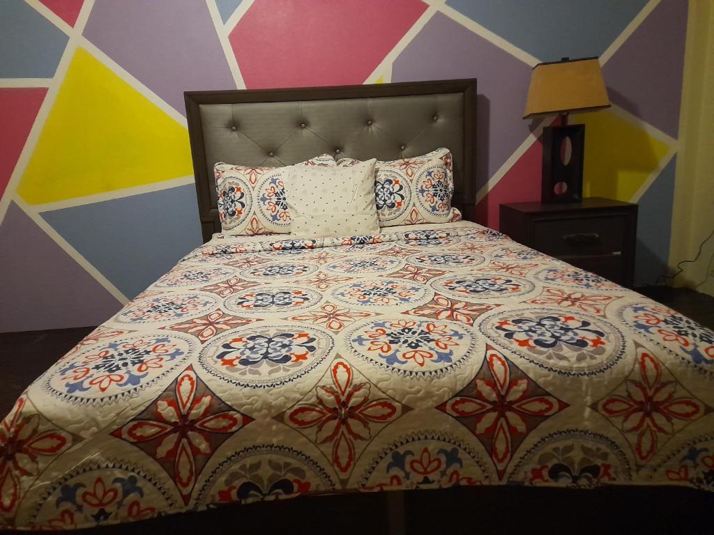 Postel nebo postele na pokoji v ubytování Tropical Suites