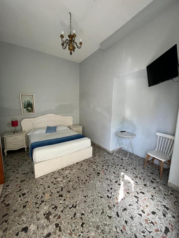 Postel nebo postele na pokoji v ubytování Hotel Queretaro