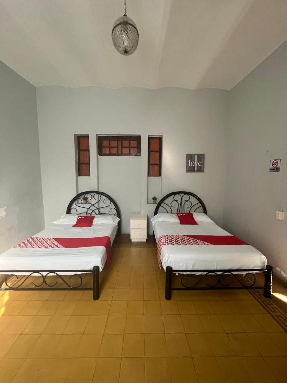 Postel nebo postele na pokoji v ubytování Hotel Queretaro