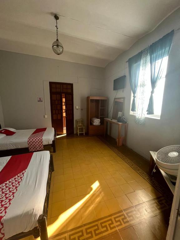 Postel nebo postele na pokoji v ubytování Hotel Queretaro