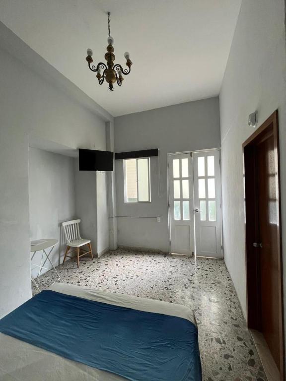 Postel nebo postele na pokoji v ubytování Hotel Queretaro