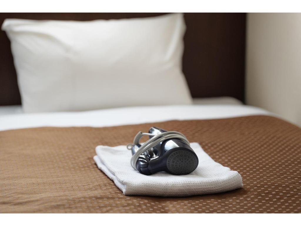 Postel nebo postele na pokoji v ubytování Hotel Suntargas Otsuka