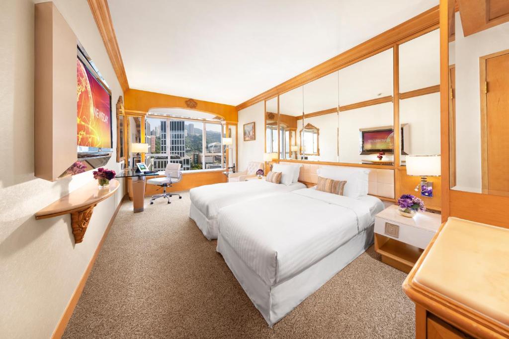 Voodi või voodid majutusasutuse Regal Hongkong Hotel toas