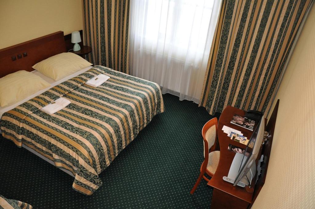 Postel nebo postele na pokoji v ubytování Hotel Terasa
