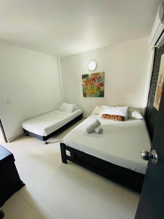 Cama o camas de una habitación en Apartamentos Sweet Island