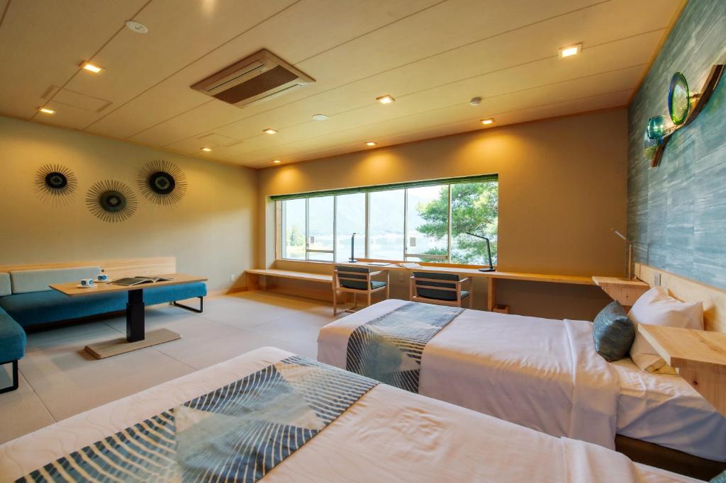 Postel nebo postele na pokoji v ubytování Fuji Lake Hotel
