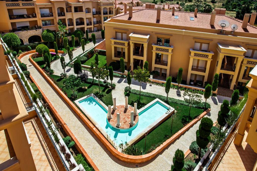 an aerial view of a mansion with a swimming pool at Baia da Luz Resort in Luz