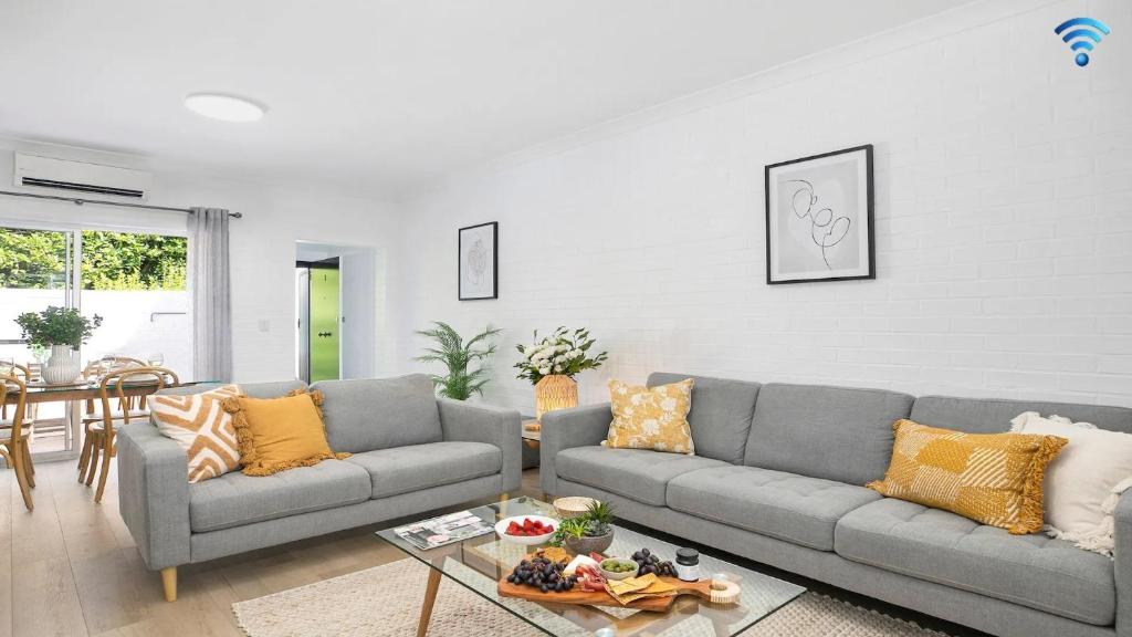 a living room with a couch and a table at 8 on Clarence in Moss Vale