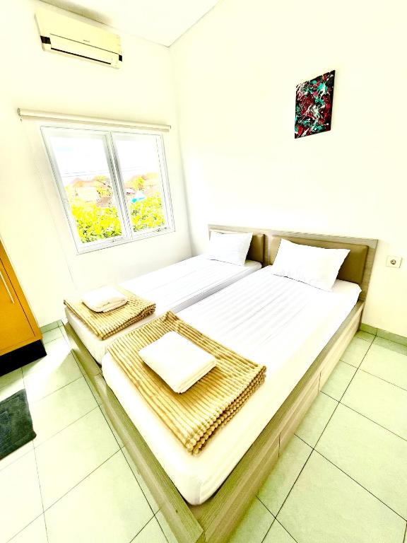 Postel nebo postele na pokoji v ubytování Best Canggu Hostel