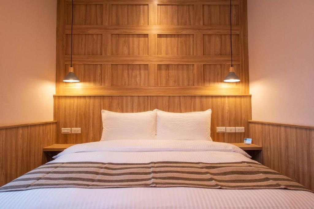 Postel nebo postele na pokoji v ubytování Shan Shui Hostel