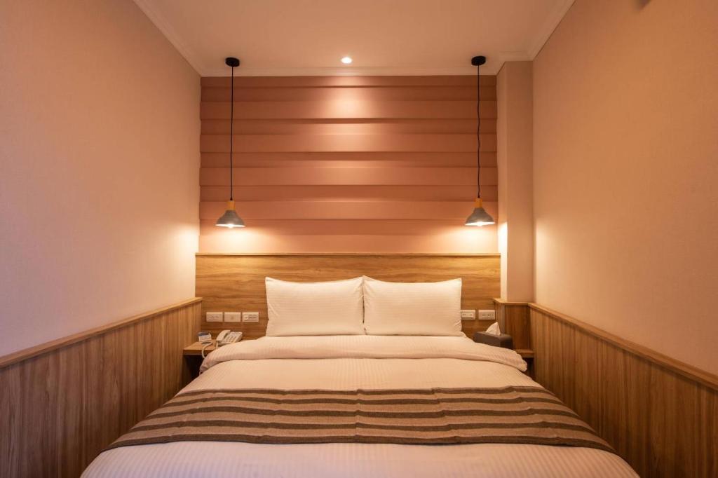 Postel nebo postele na pokoji v ubytování Shan Shui Hostel