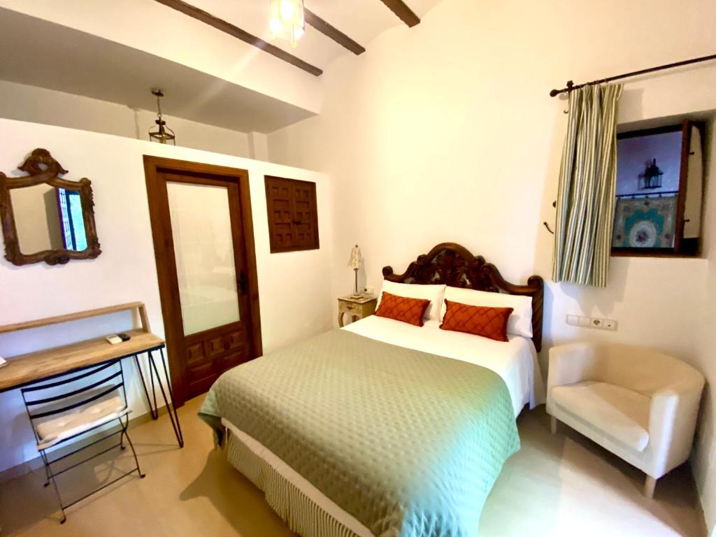 Cama o camas de una habitación en El Rincón de las Descalzas