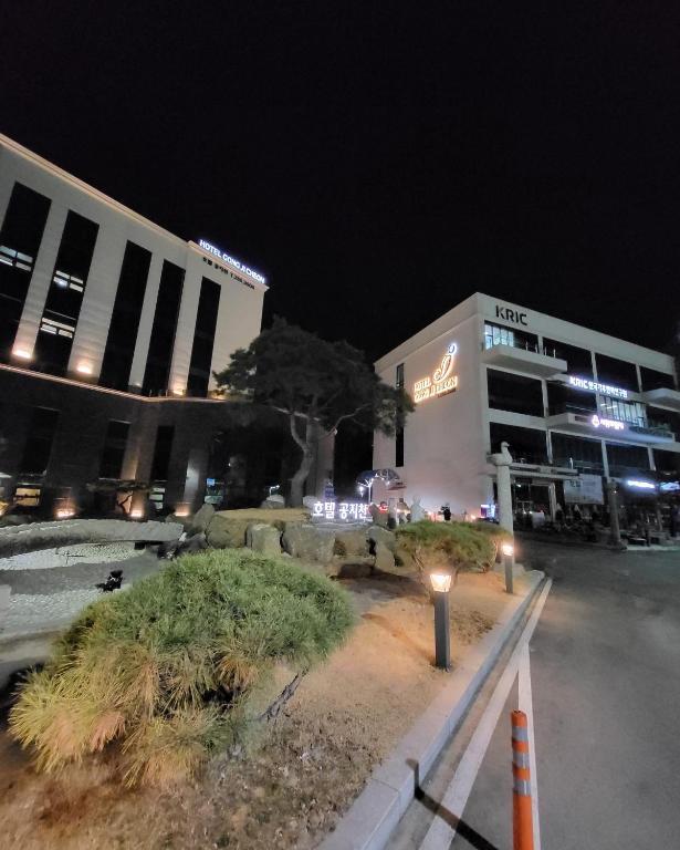 a group of buildings at night with lights at Hotel Gongjicheon in Chuncheon