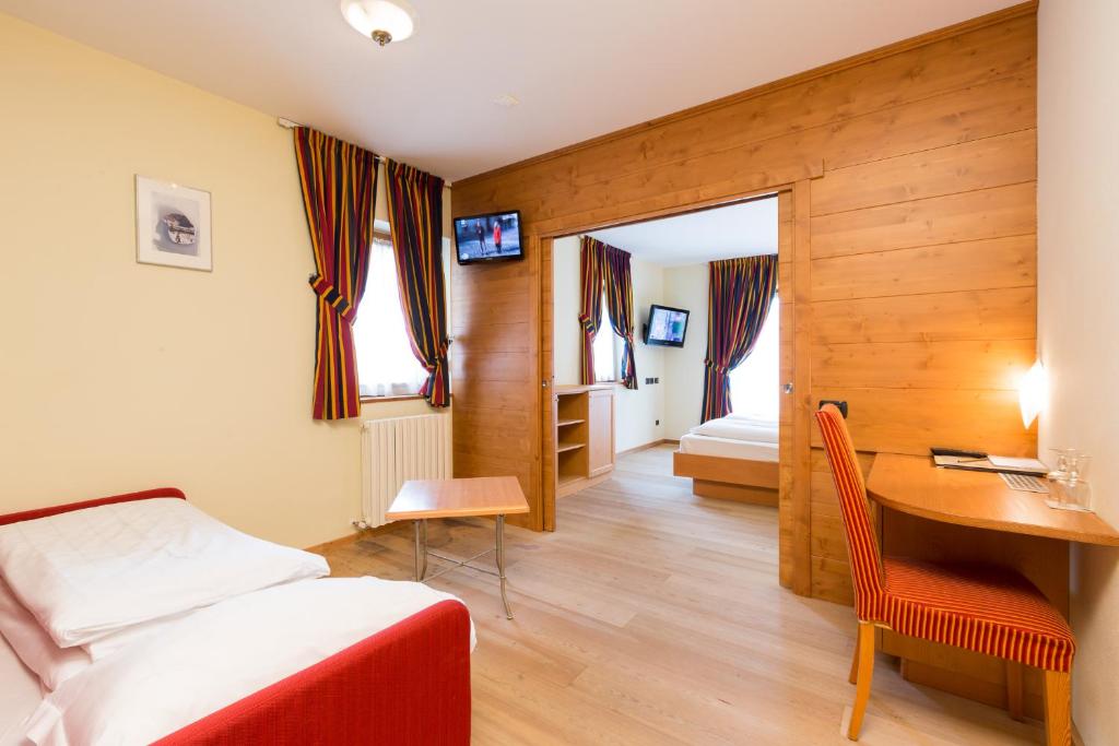 Postel nebo postele na pokoji v ubytování Hotel Touring
