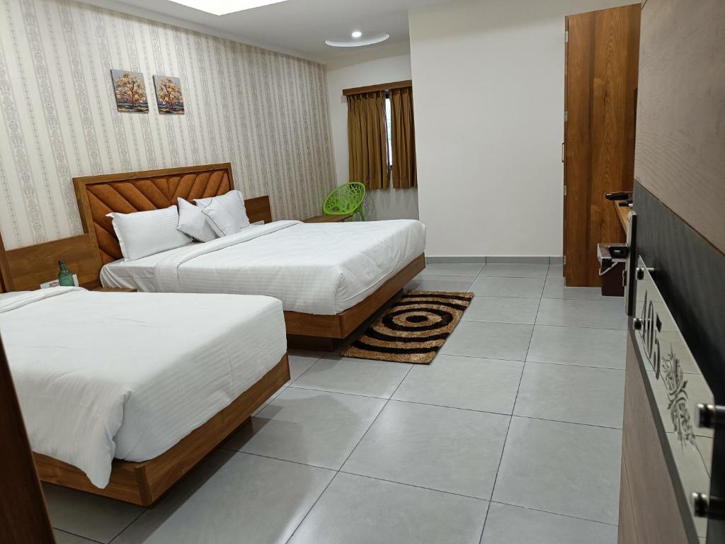 Postel nebo postele na pokoji v ubytování Hotel Lotus