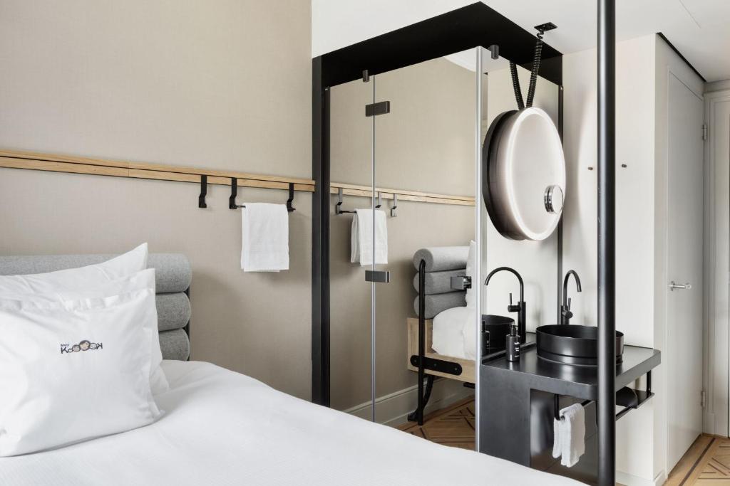Letto o letti in una camera di Stay KooooK Bern City - Online Check In