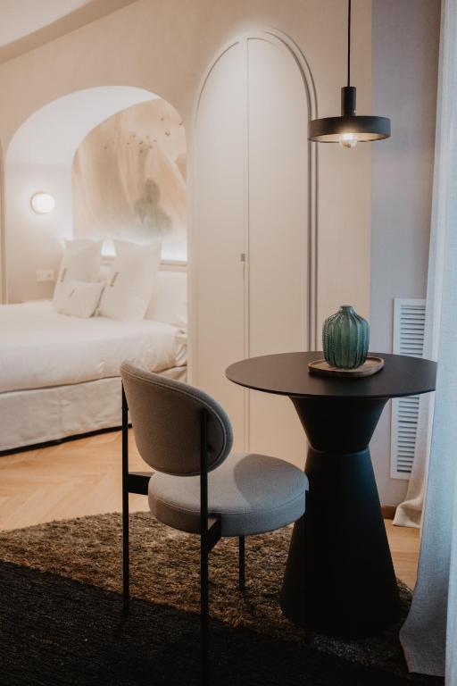 Posteľ alebo postele v izbe v ubytovaní Hotel Petit Luxe
