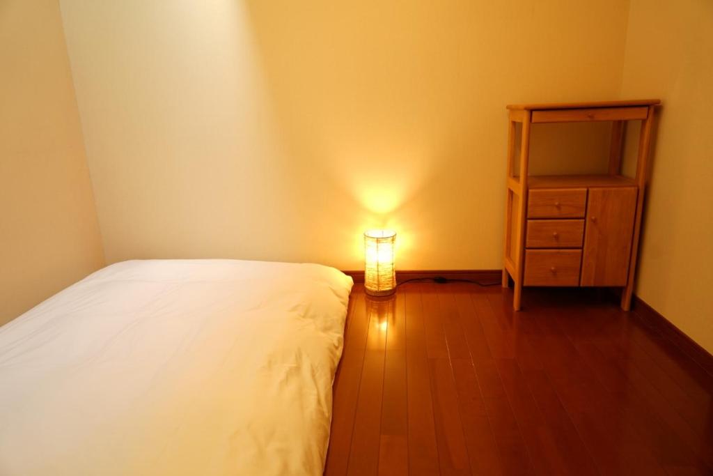 Postel nebo postele na pokoji v ubytování Seiko