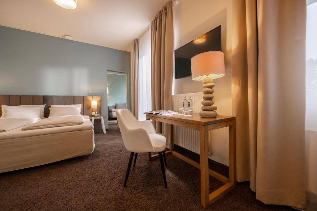 Postel nebo postele na pokoji v ubytování SAND Lifestylehotel